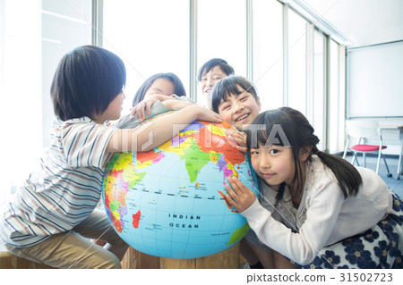 Elementary school student with globe 31502723