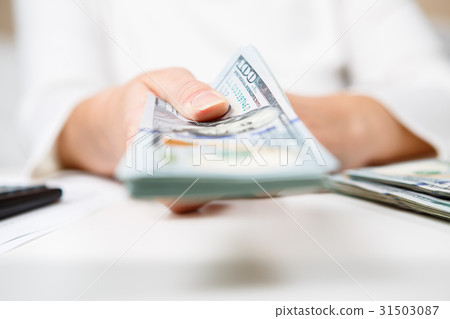 Hands of person proposing money to you - closeup 31503087