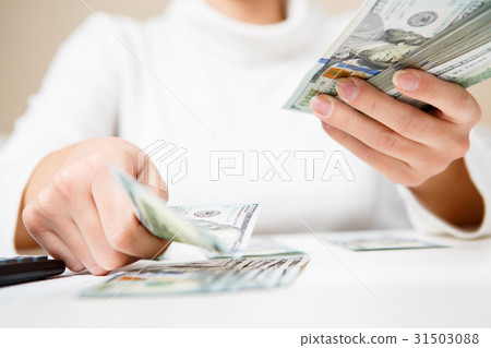 Hands counting money, close up 31503088