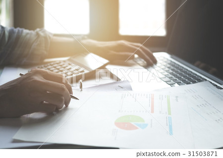 Businessman working with calculator,  31503871