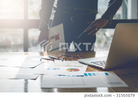 young business man standing hand holding report young business man standing hand holding report 31503879
