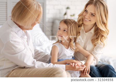 Cute little girl socializing with her pleasant 31504938