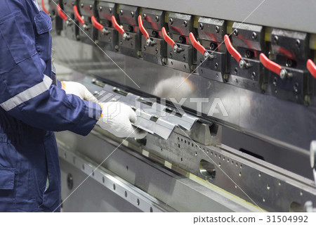The technician operator use bending machine. 31504992