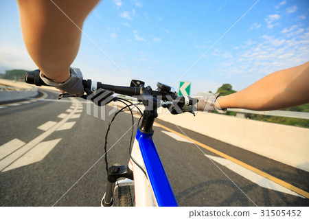 hands cycling mountain bike on driving road 31505452