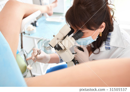 Professional gynecologist examining her patient  31505537
