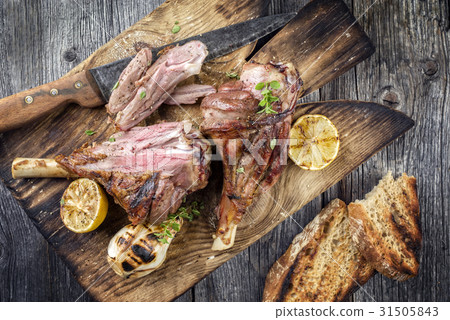 Barbecue Lamb Knuckles on old Cutting Board Barbecue Lamb Knuckles on old Cutting Board 31505843