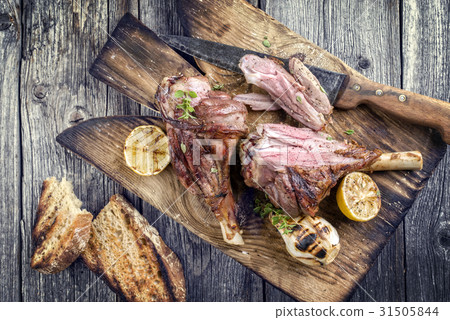 Barbecue Lamb Knuckles on old Cutting Board Barbecue Lamb Knuckles on old Cutting Board 31505844
