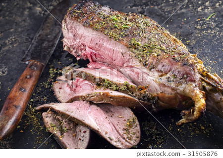 Barbecue Haunch of Venison on old Metal Sheet 31505876