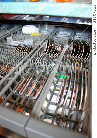 Open dishwasher with clean spoons, selective focus Open dishwasher with clean spoons, selective focus 31507216