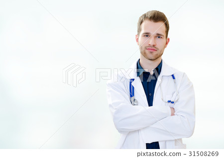 Handsome young doctor in office 31508269