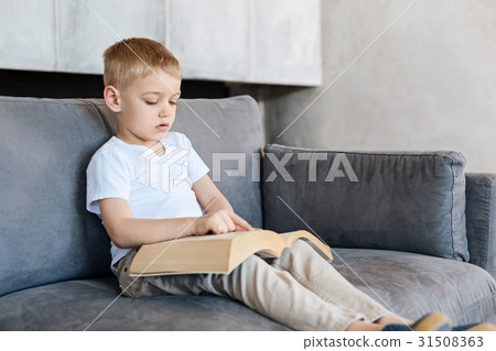 Brilliant amazing creative kid reading a book Brilliant amazing creative kid reading a book 31508363