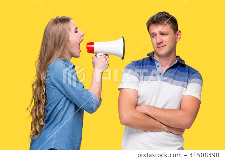 Woman shouting in megaphones at each other Woman shouting in megaphones at each other 31508390