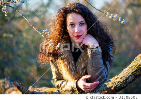 beautiful Woman leaned on a tree, autumn 31508505