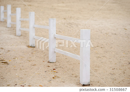 wooden fence on a beach on a cold autumn day 31508667