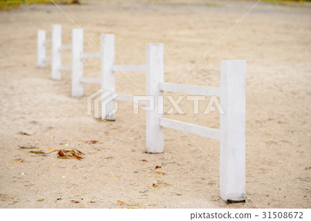 wooden fence on a beach on a cold autumn day wooden fence on a beach on a cold autumn day 31508672