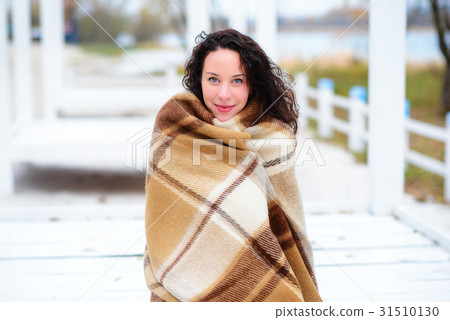 beautiful girl dressed in plaid autumn beach 31510130