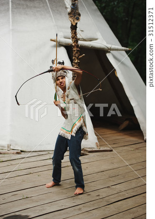 little funny boy playing native american 31512371
