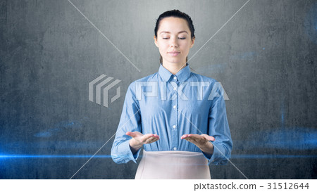 Young beautiful business woman looking down on her Young beautiful business woman looking down on her 31512644