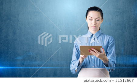 Young beautiful business woman with gold tablet Young beautiful business woman with gold tablet 31512667