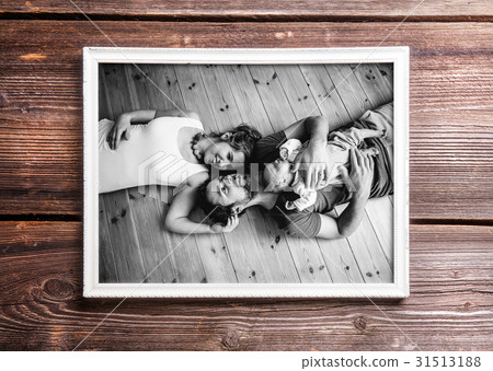 Picture of parents holding baby daughter. Fathers Picture of parents holding baby daughter. Fathers 31513188