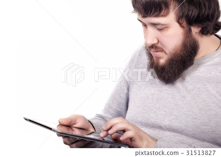 Bearded blogger typing text information for 31513827