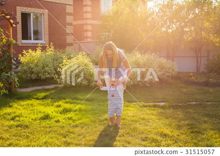 First steps of little adorable toddler boy, Happy 31515057