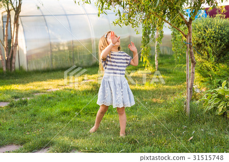 cute little girl in spring or summer day 31515748