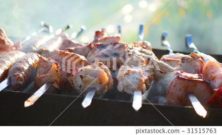 Barbecue Delicious Meat Cooked on the grill. A 31515763