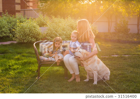 Mother and her daughter and son in the garden with Mother and her daughter and son in the garden with 31516400