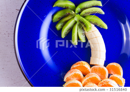 Fruit salad in form of tropical plams Fruit salad in form of tropical plams 31516840