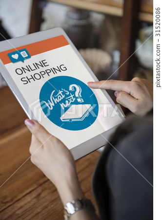 Hands working on digital device network graphic overlay 31520086