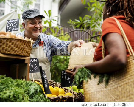 Man owner fresh grocery organic shop with customer 31520661