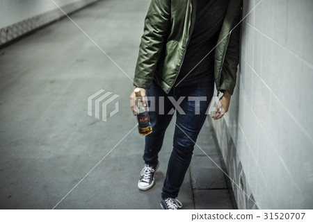 Homeless Alcoholism Man Holding Liquor Bottle 31520707