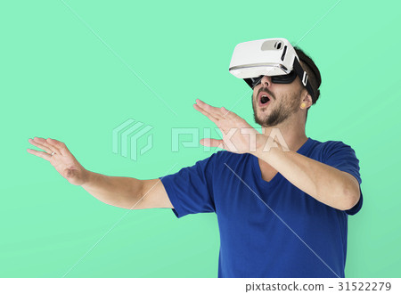 A man using a visualiaing reality gadget A man using a visualiaing reality gadget 31522279