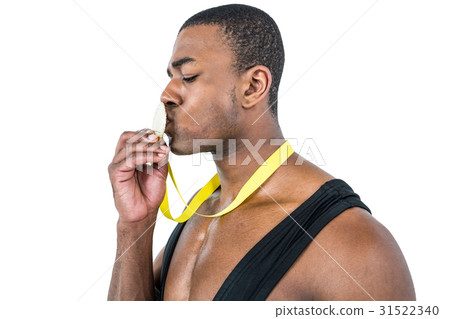 Happy athlete kissing medal Happy athlete kissing medal 31522340