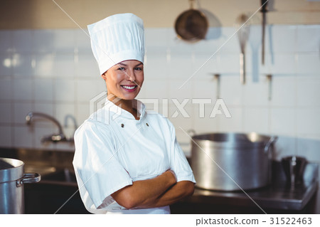 Portrait of happy chef standing with arms crossed 31522463