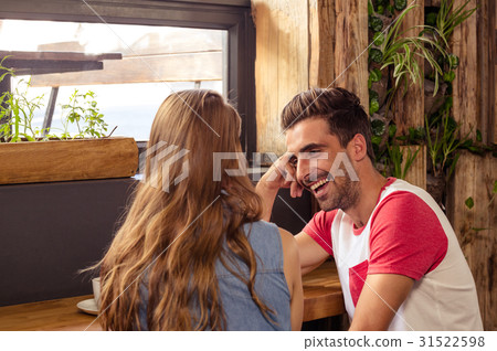 Smiling couple talking Smiling couple talking 31522598