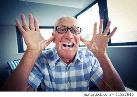 Senior man making a funny face Senior man making a funny face 31522616