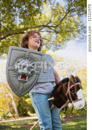Cute boy pretending to be a knight Cute boy pretending to be a knight 31522979