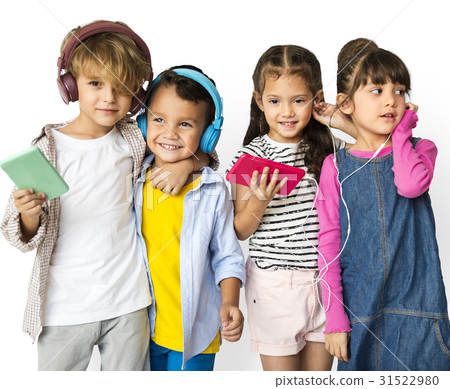 Happiness group of cute and adorable children listening music Happiness group of cute and adorable children listening music 31522980