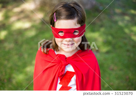 Young girl pretending to be a superhero Young girl pretending to be a superhero 31523070
