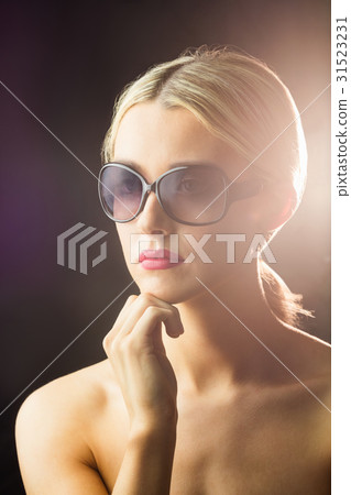 Portrait of woman posing for the camera Portrait of woman posing for the camera 31523231