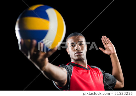 Sportsman playing a volleyball 31523255