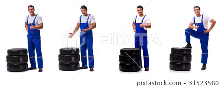 Handsome tyre repairman isolated on white Handsome tyre repairman isolated on white 31523580