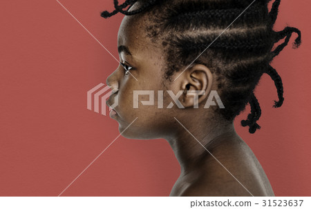 African little girl bare chest studio portrait in side view 31523637