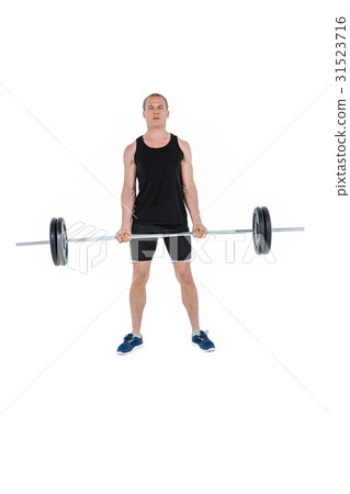 Bodybuilder lifting heavy barbell weights 31523716