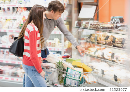 Handsome man finger pointing a pastry 31523977