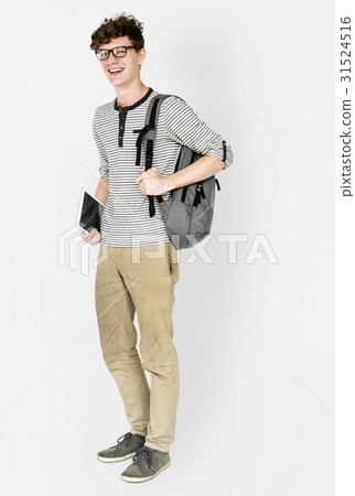 Caucasian young man standing with backpack and tablet 31524516