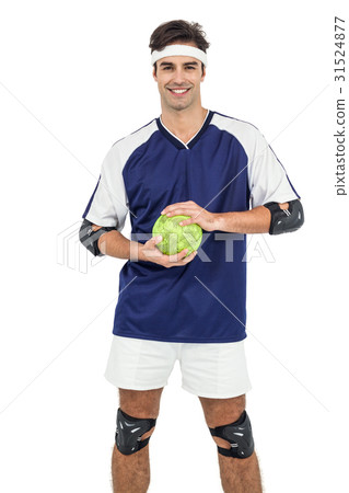 圖庫照片: sportsman standing with ball on white background