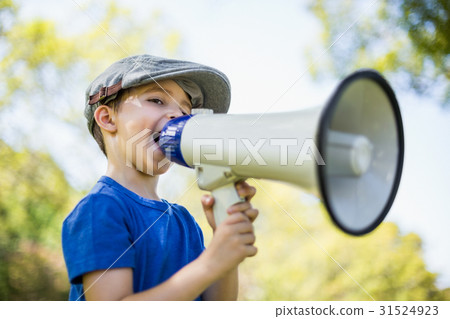 Young boy speaking on megaphone 31524923